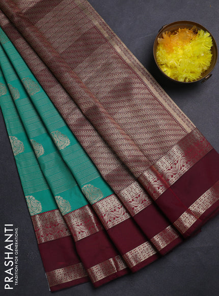 Semi kanchipuram silk saree teal green shade and wine shade with allover zari weaves & buttas and rettapet zari woven korvai border