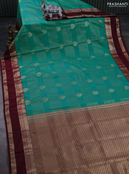 Semi kanchipuram silk saree teal green shade and wine shade with allover zari weaves & buttas and rettapet zari woven korvai border