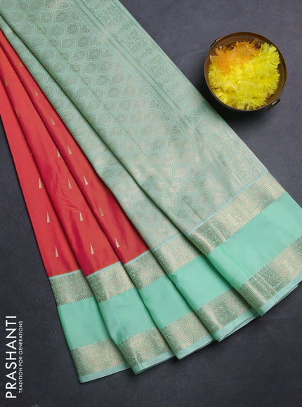 Semi kanchipuram silk saree dual shade of pinkish orange and teal green shade with zari woven buttas and rettapet zari woven korvai border