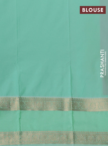 Semi kanchipuram silk saree dual shade of pinkish orange and teal green shade with zari woven buttas and rettapet zari woven korvai border
