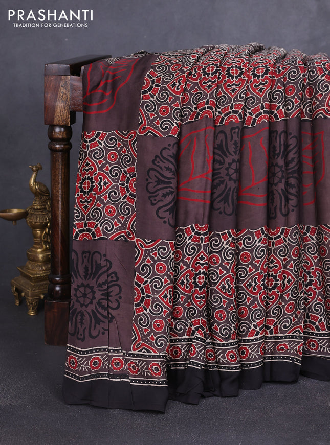 Modal silk saree brown and black with allover ajrakh prints and printed border