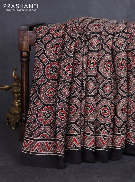 Modal silk saree pastel brown and black with allover ajrakh prints and printed border