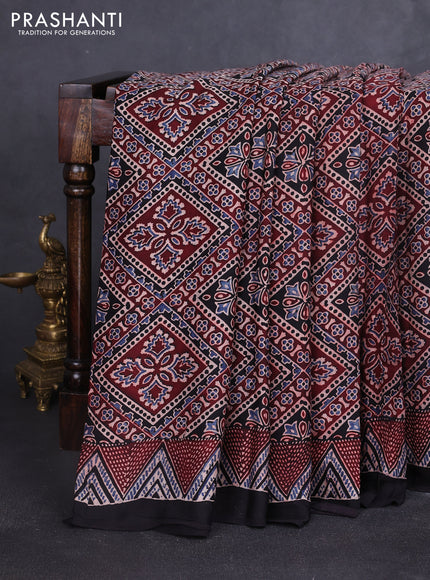 Modal silk saree black with allover ajrakh prints and printed border