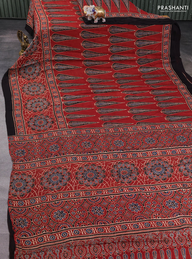 Modal silk saree rustic orange and coffee brown with allover ajrakh prints and printed border