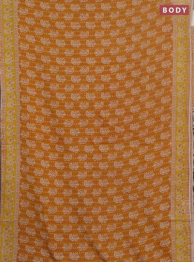 Kalamkari cotton saree mustard yellow and beige with allover paisley prints and printed border