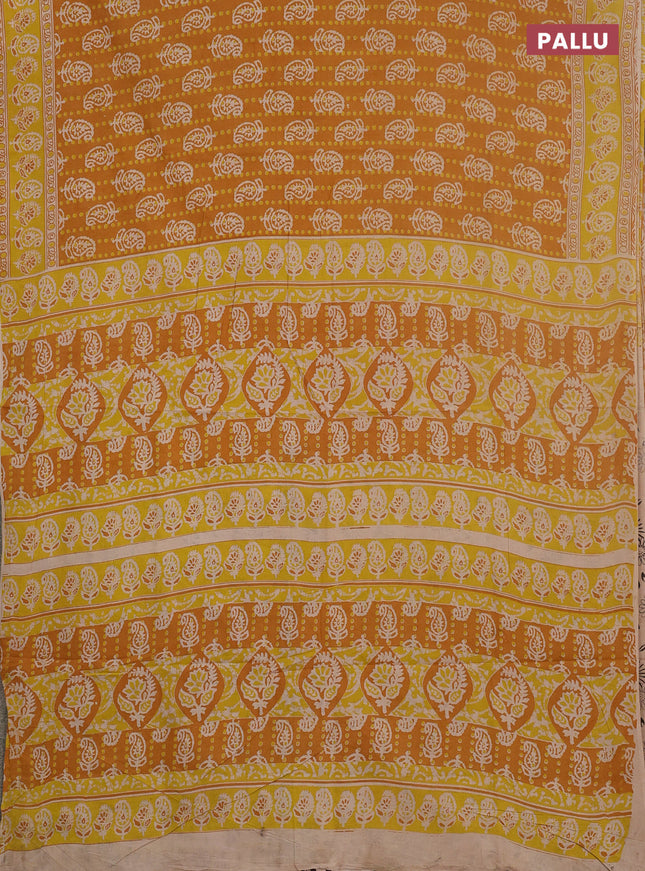 Kalamkari cotton saree mustard yellow and beige with allover paisley prints and printed border