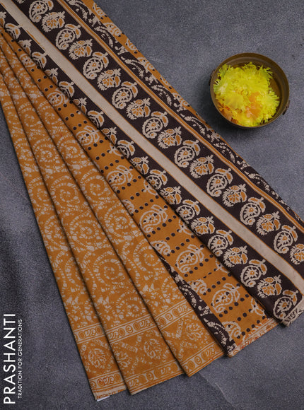 Kalamkari cotton saree mustard yellow and beige with allover batik prints and printed border