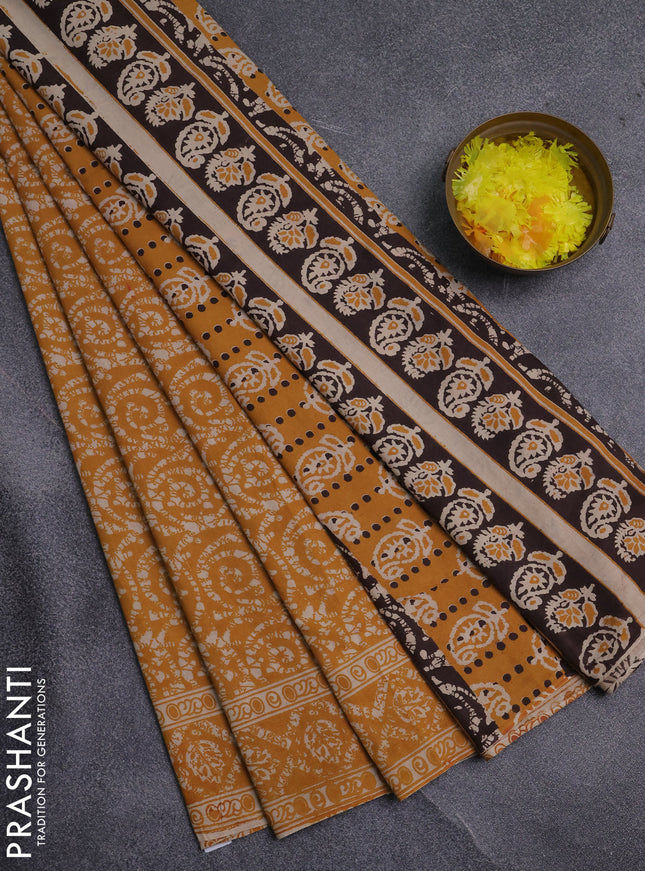 Kalamkari cotton saree mustard yellow and beige with allover batik prints and printed border