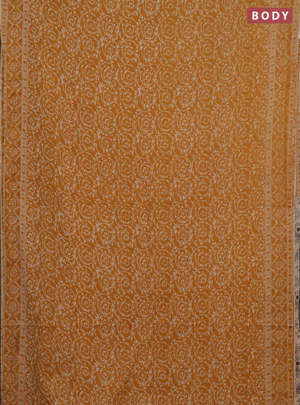 Kalamkari cotton saree mustard yellow and beige with allover batik prints and printed border