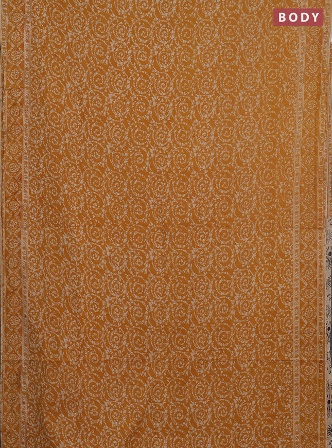 Kalamkari cotton saree mustard yellow and beige with allover batik prints and printed border
