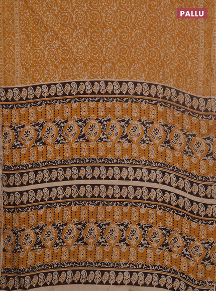 Kalamkari cotton saree mustard yellow and beige with allover batik prints and printed border