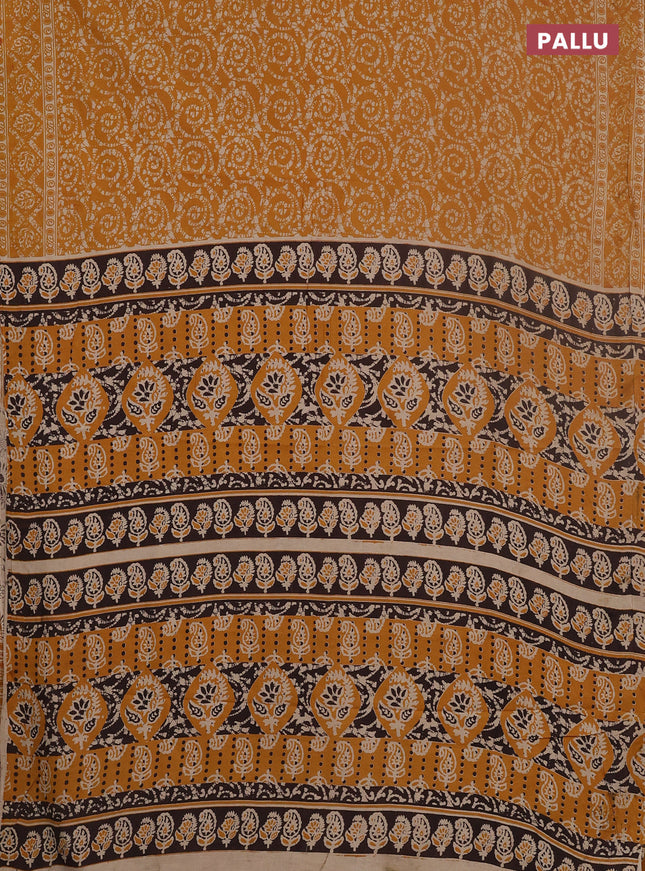 Kalamkari cotton saree mustard yellow and beige with allover batik prints and printed border