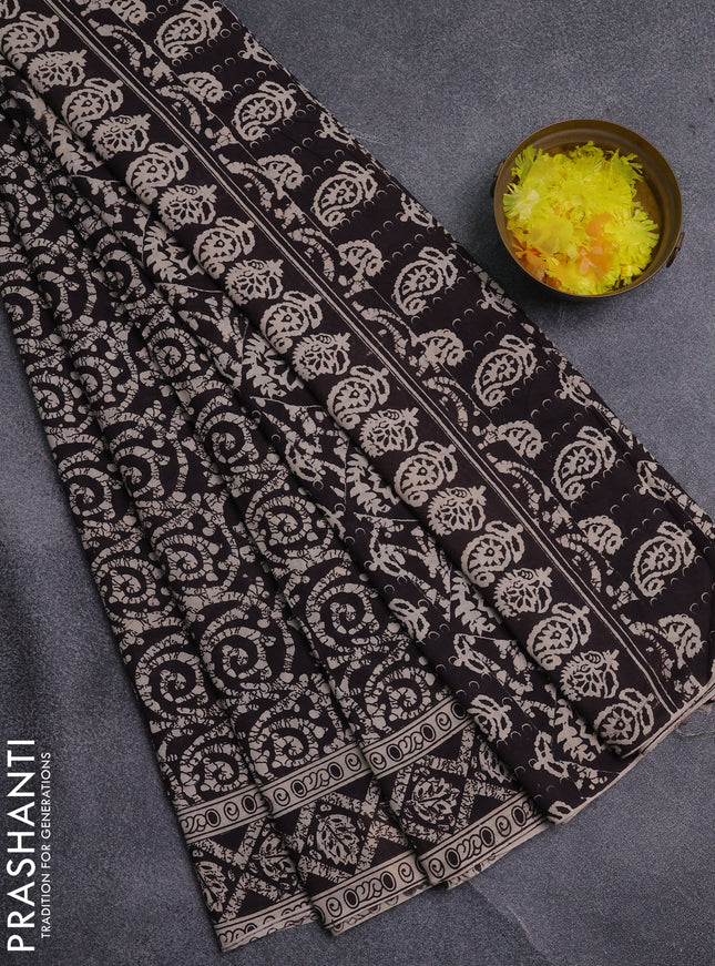 Kalamkari cotton saree black and beige with allover batik prints and printed border