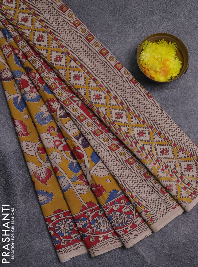 Kalamkari cotton saree mustard yellow and red with allover prints and printed border