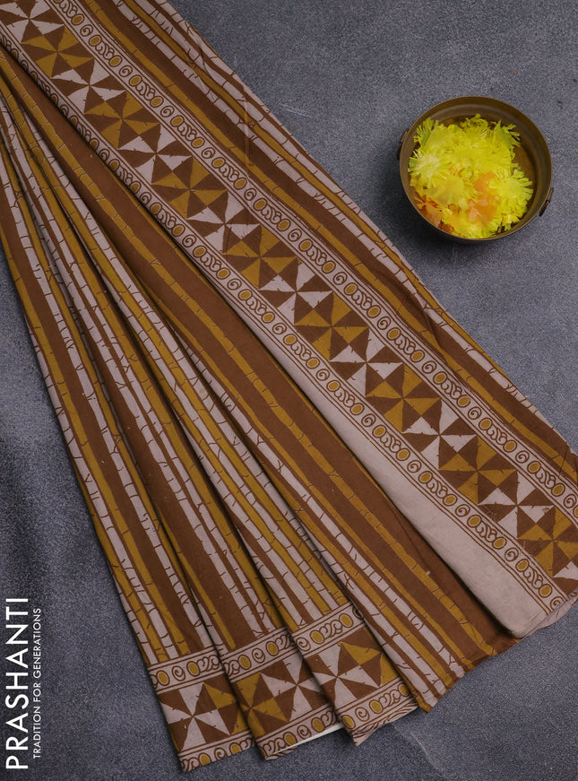 Kalamkari cotton saree dark mustard and yellow with allover prints and printed border
