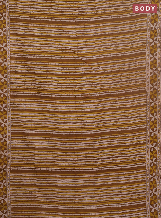 Kalamkari cotton saree dark mustard and yellow with allover prints and printed border