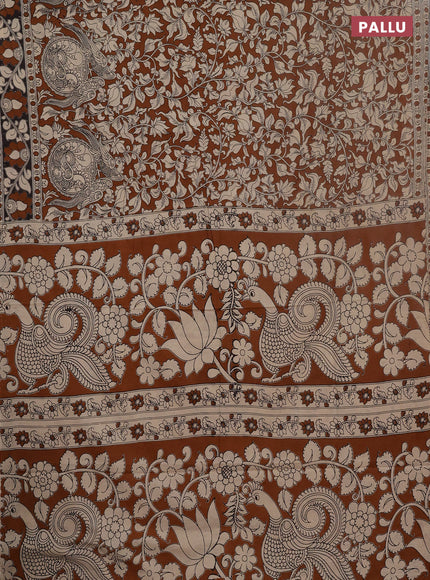 Kalamkari cotton saree dark mustard and black with allover prints and printed border