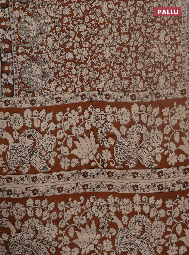 Kalamkari cotton saree dark mustard and black with allover prints and printed border