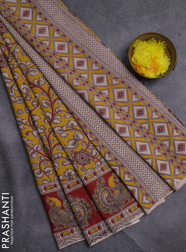Kalamkari cotton saree yellow and maroon with allover prints and printed border
