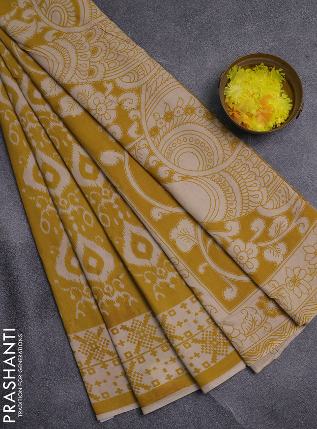 Kalamkari cotton saree yellow and beige with allover ikat prints and printed border