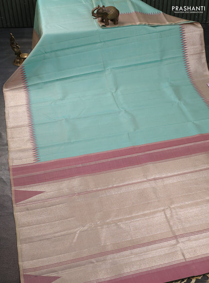 Pure kanchipuram silk saree teal blue and dual shade of magenta pink with allover small zari checked pattern and temple design zari woven border