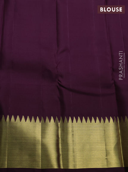 Pure kanchipuram silk saree deep purple with allover zari woven brocade weaves and temple design zari woven border