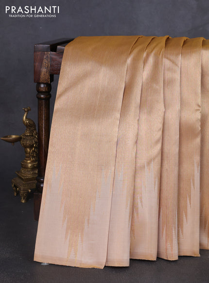 Pure kanchipuram tissue silk saree sandal and dual shade of pinkish orange with palin body and temple design border