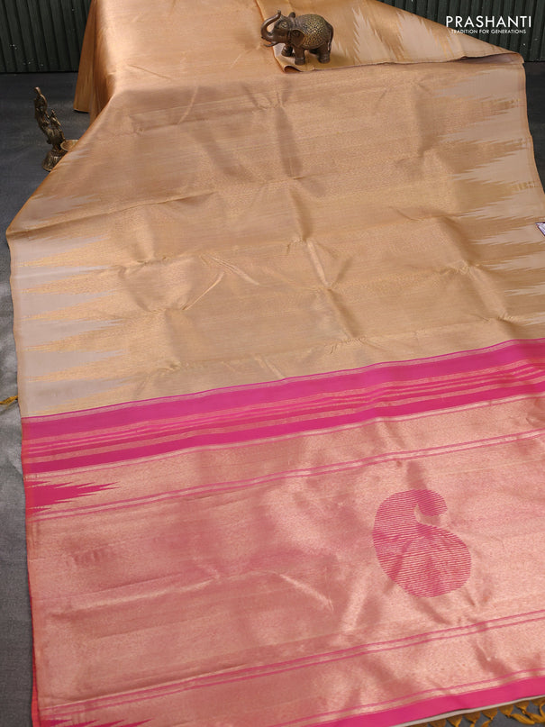 Pure kanchipuram tissue silk saree sandal and dual shade of pinkish orange with palin body and temple design border