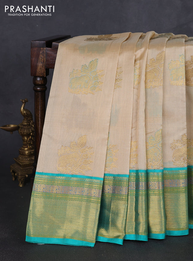Kora kanchipuram silk saree cream and teal blue with zari woven buttas and rich zari woven border