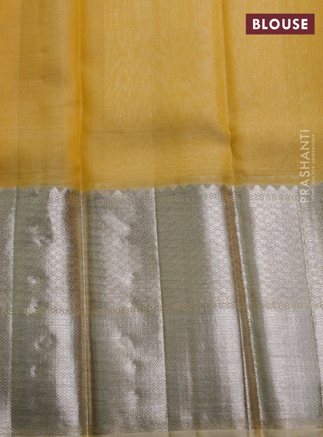 Kora kanchipuram silk saree yellow and pale yellow with silver zari woven buttas and long silver zari woven border