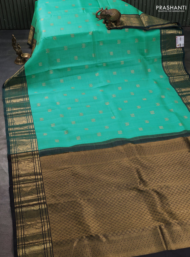 Kora kanchipuram silk saree teal blue and peacock green with zari woven buttas and annam zari woven border