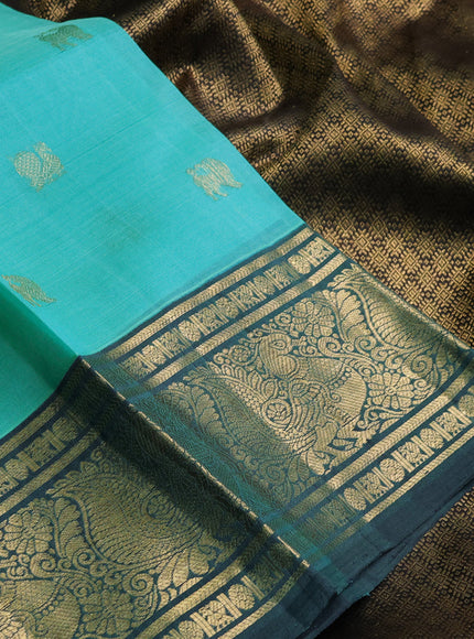 Kora kanchipuram silk saree teal blue and peacock green with zari woven buttas and annam zari woven border