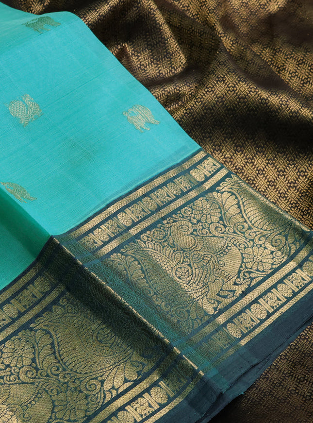 Kora kanchipuram silk saree teal blue and peacock green with zari woven buttas and annam zari woven border