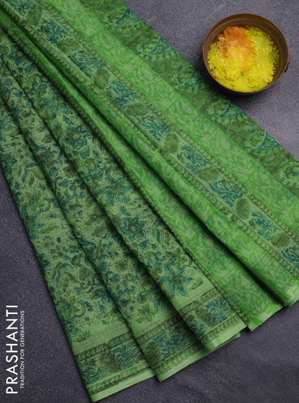 Kota doria saree light green with allover prints and printed border