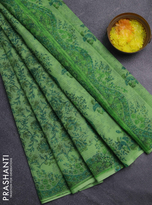Kota doria saree light green with allover prints and printed border