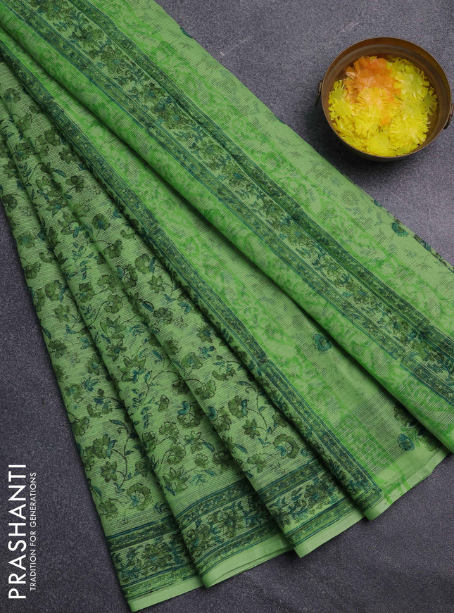 Kota doria saree light green with allover prints and printed border
