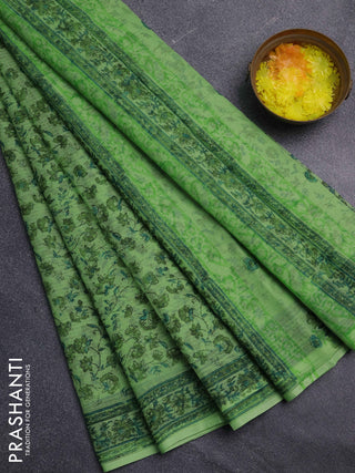 Kota doria saree light green with allover prints and printed border
