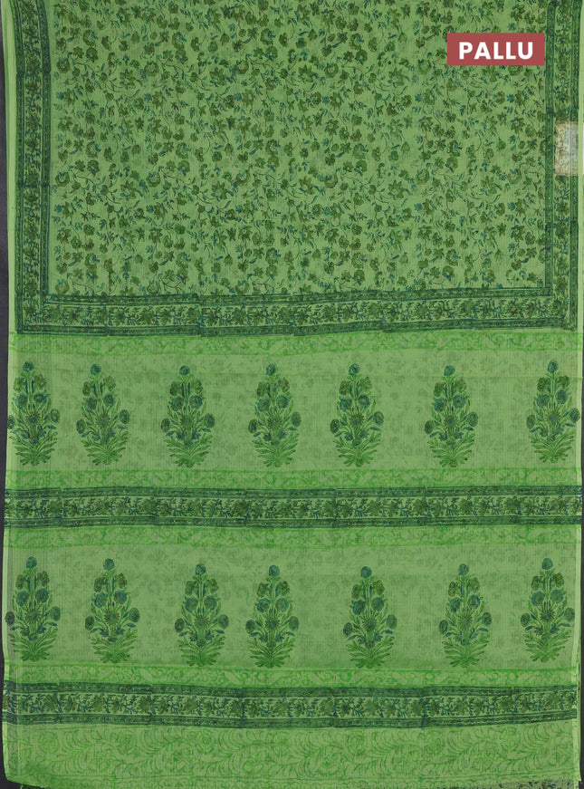 Kota doria saree light green with allover prints and printed border