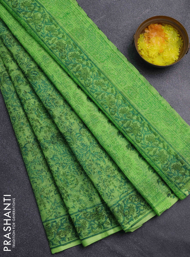 Kota doria saree light green with allover prints and printed border