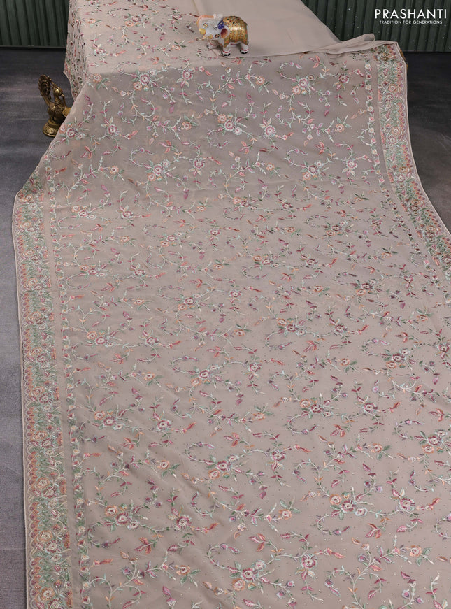 Georgette saree beige with allover embroidery stone work and embroidery stone work border