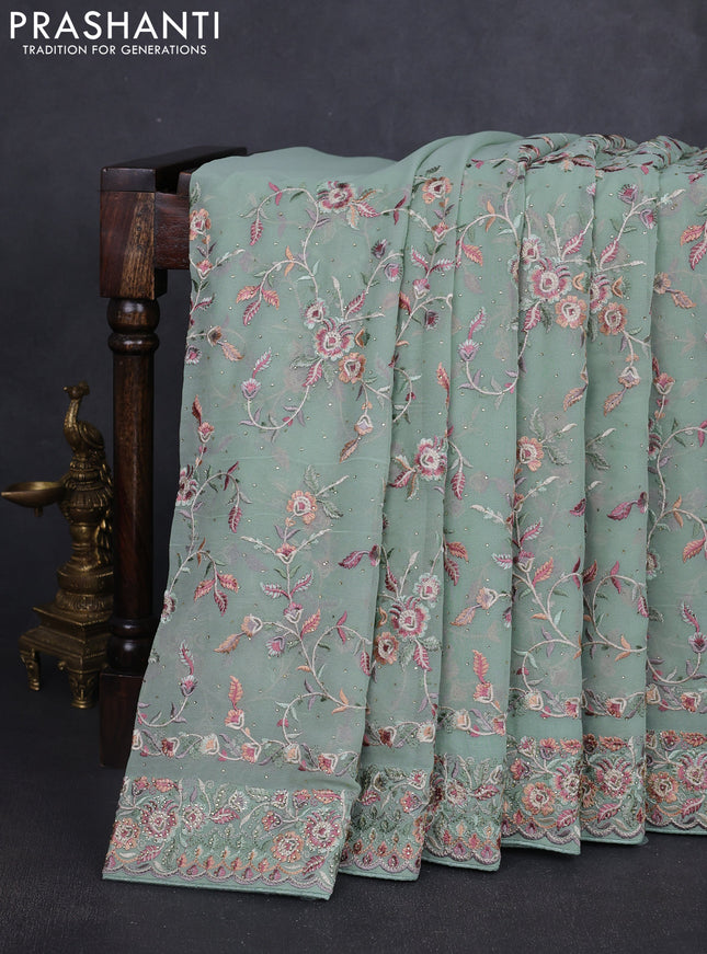 Georgette saree pastel green with allover embroidery stone work and embroidery stone work border