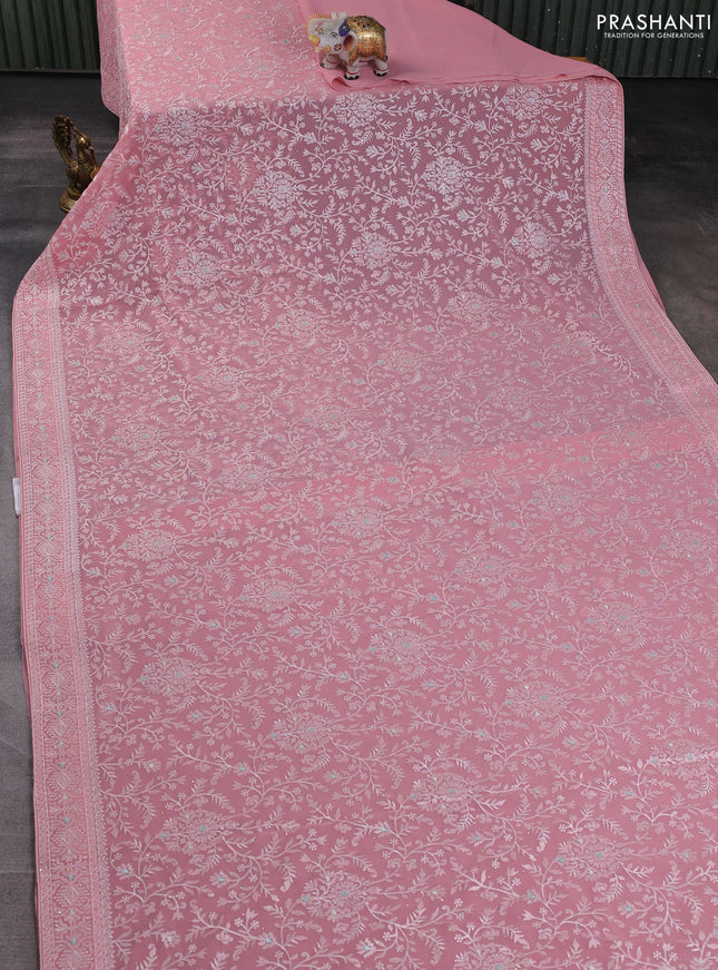 Georgette saree peach shade with allover embroidery work and embroidery border