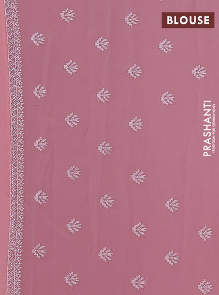 Georgette saree peach shade with allover embroidery work and embroidery border