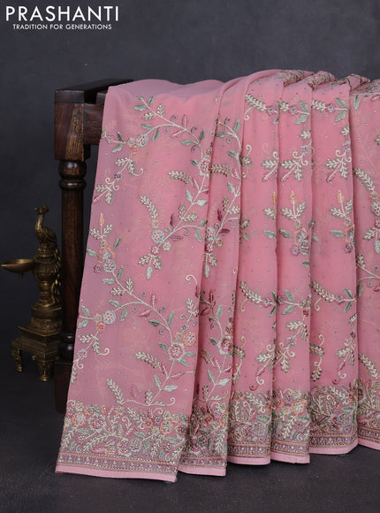 Georgette saree peach shade with allover embroidery stone work and embroidery stone work border