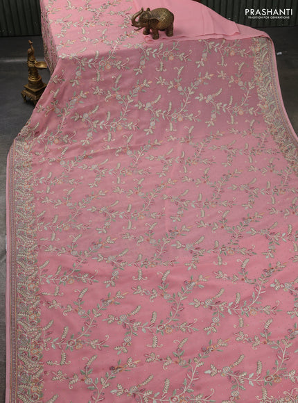 Georgette saree peach shade with allover embroidery stone work and embroidery stone work border