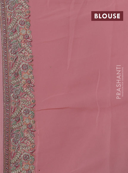 Georgette saree peach shade with allover embroidery stone work and embroidery stone work border