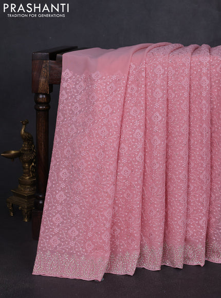 Georgette saree peach pink with allover embroidery work and stone work border