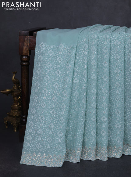 Georgette saree pastel blue with allover embroidery work and stone work border