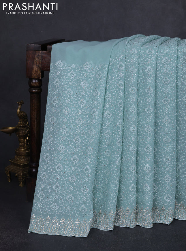 Georgette saree pastel blue with allover embroidery work and stone work border