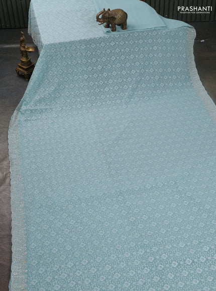 Georgette saree pastel blue with allover embroidery work and stone work border